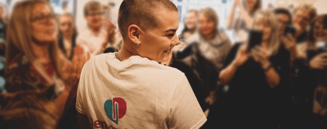 A fundraiser shaving off their hair for Dementia UK