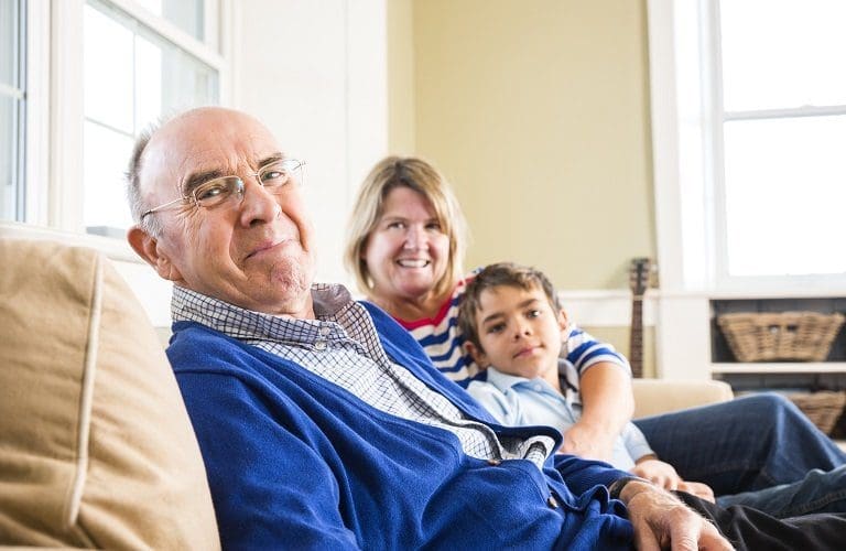 A grandfather, his daughter and her son at home