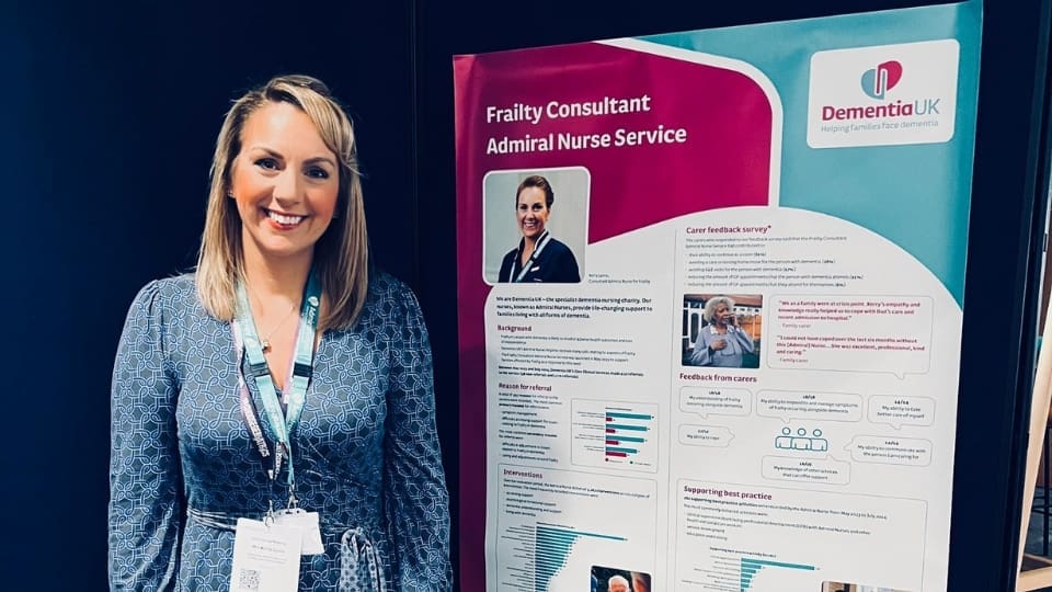 Kerry Lyons, Consultant Admiral Nurse for frailty presenting a Dementia UK stand at a conference.