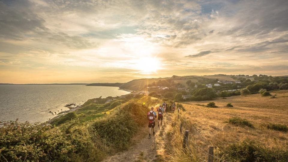 a group hiking along the Jurassic Coast