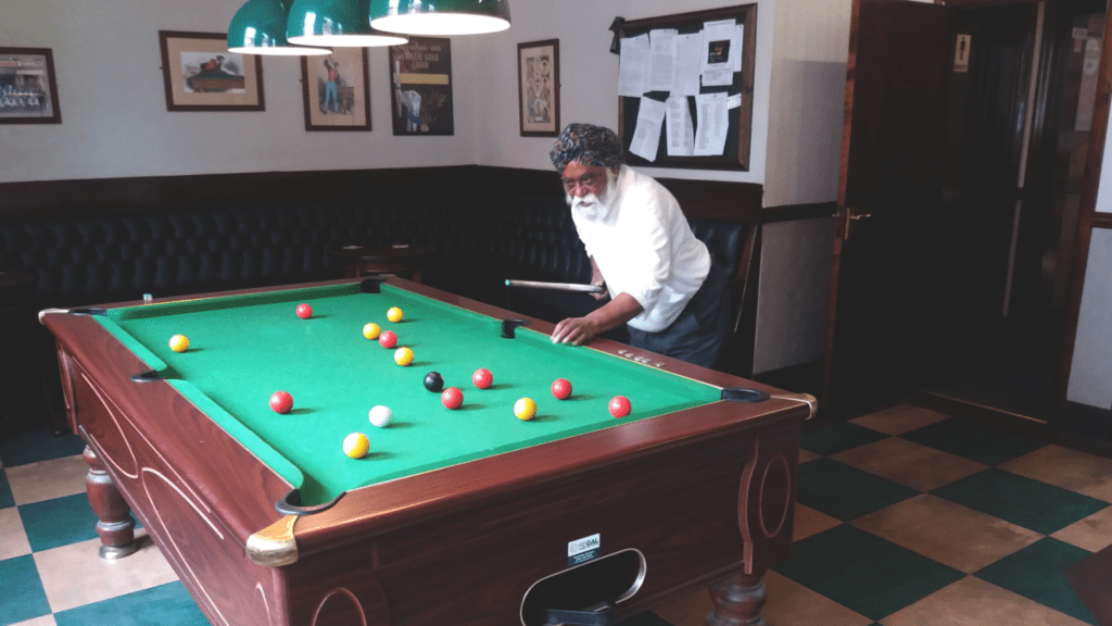 Mohinder playing pool