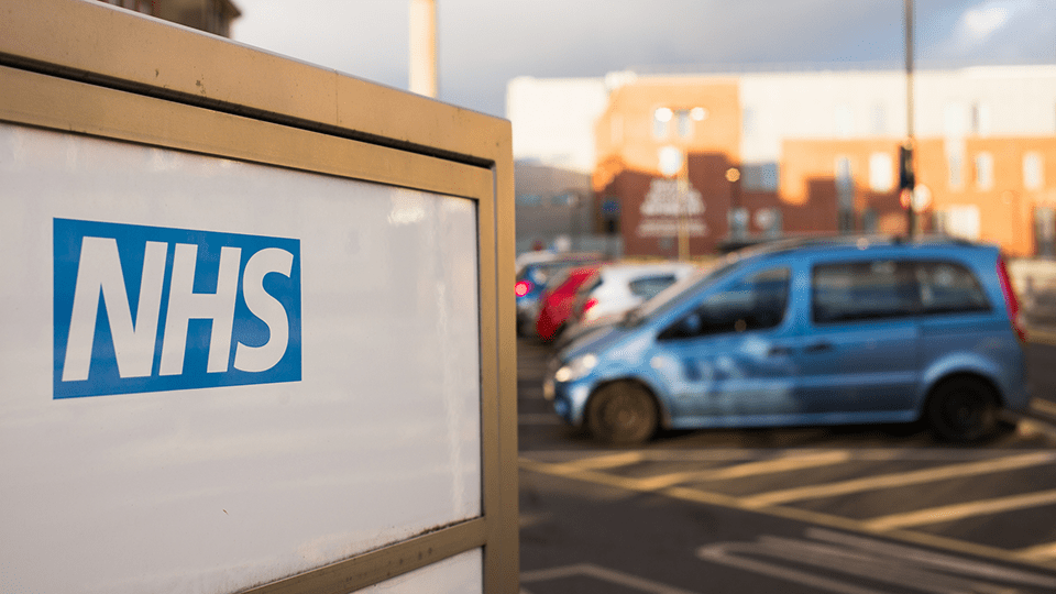 NHS logo on sign in carpark