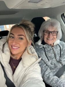 Nat pictured with her Nan in the car.