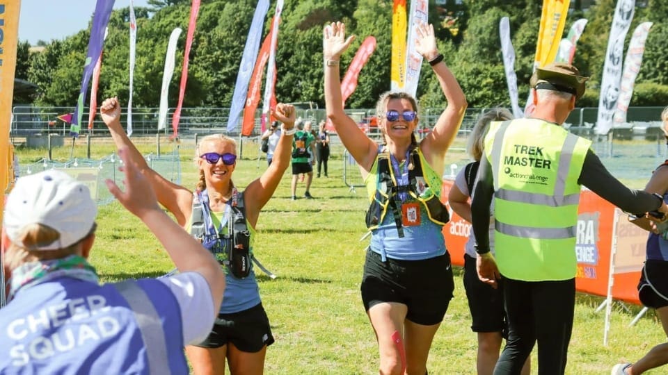 event participants cheering with their hands in the air