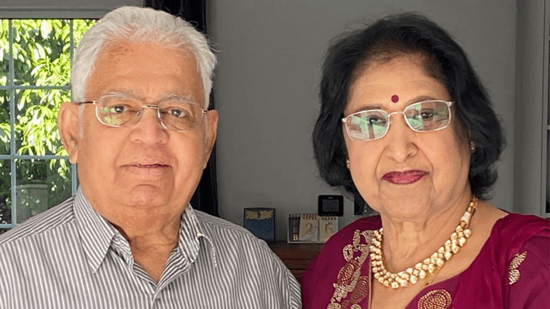 Pratibha smiles with her husband alongside her