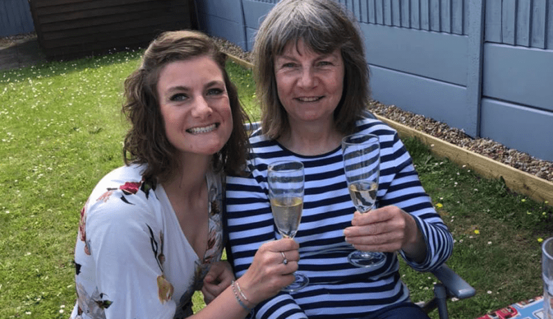 Rosie shares a drink with her mum