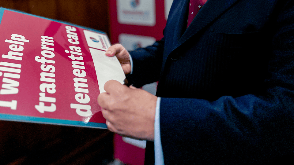 MP signing a board