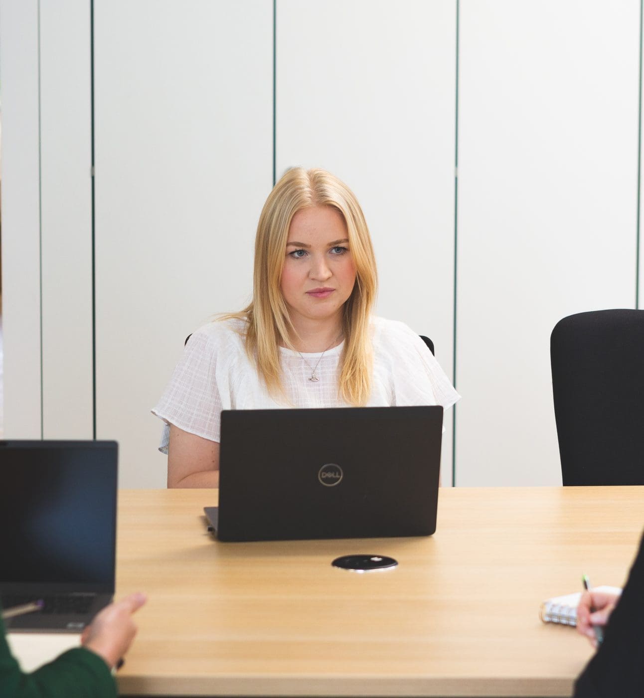 Three collegues work together in an office