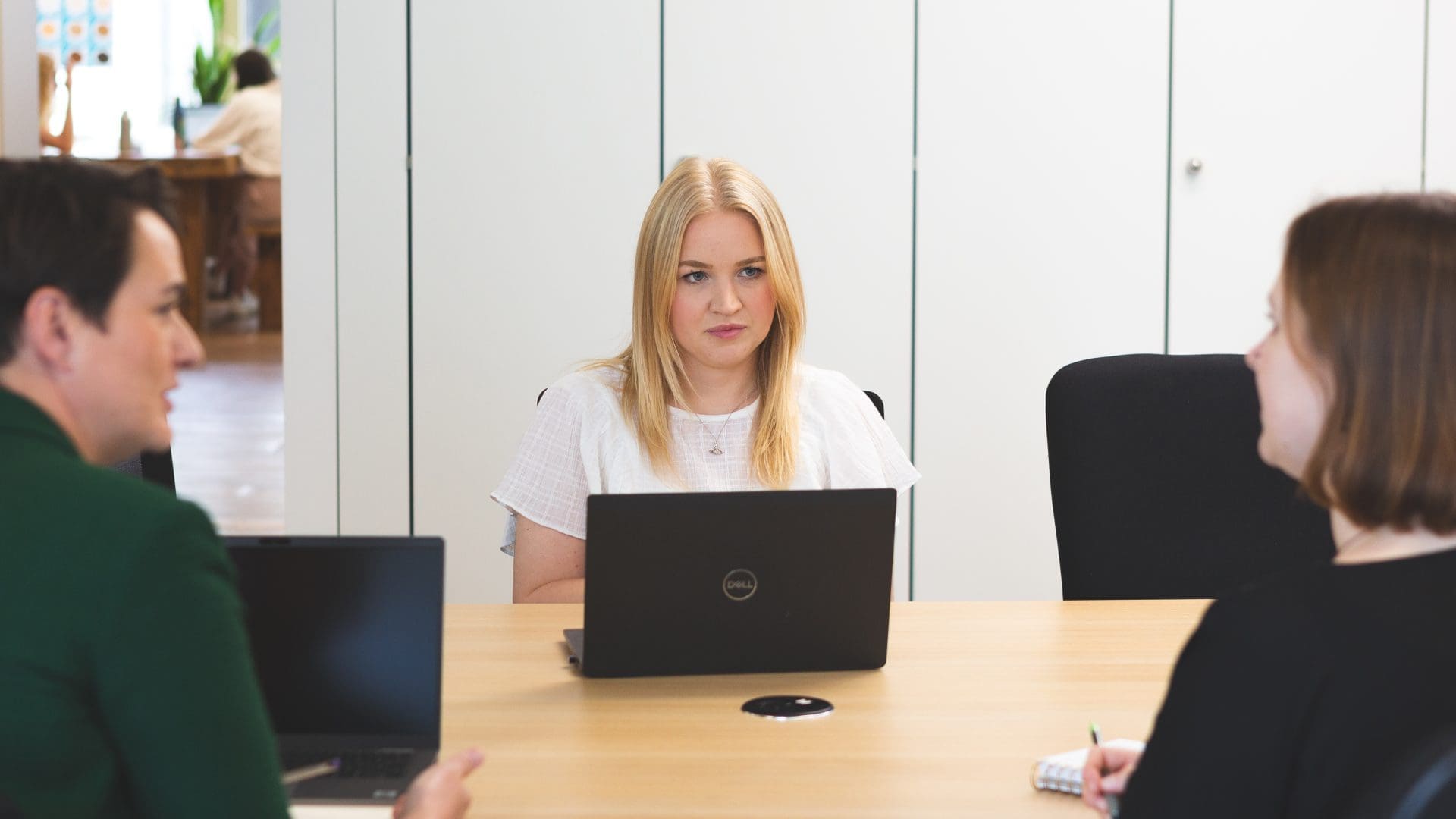 Three collegues work together in an office