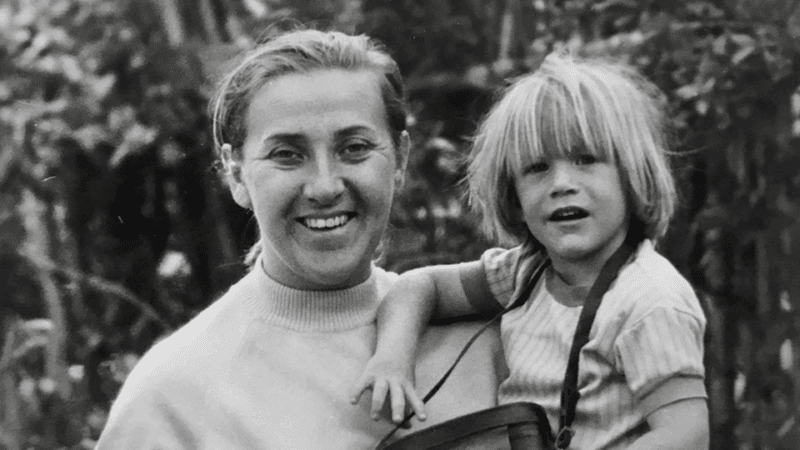 Steve as a young child is held by his mum