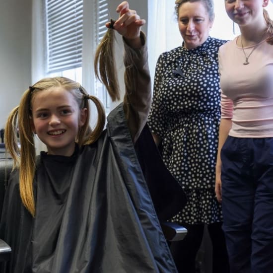 Supporter Rhys, holding a piece of their hair