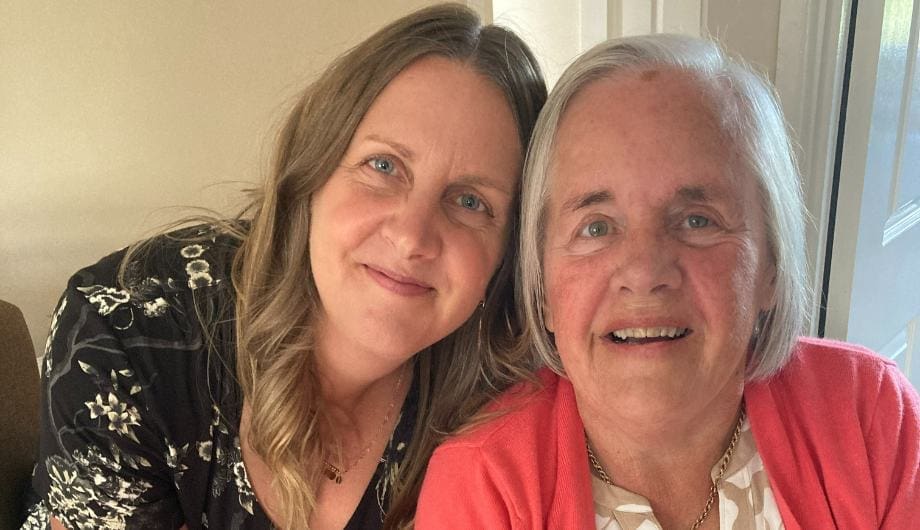 Supporter Suzy and her mum smiling 