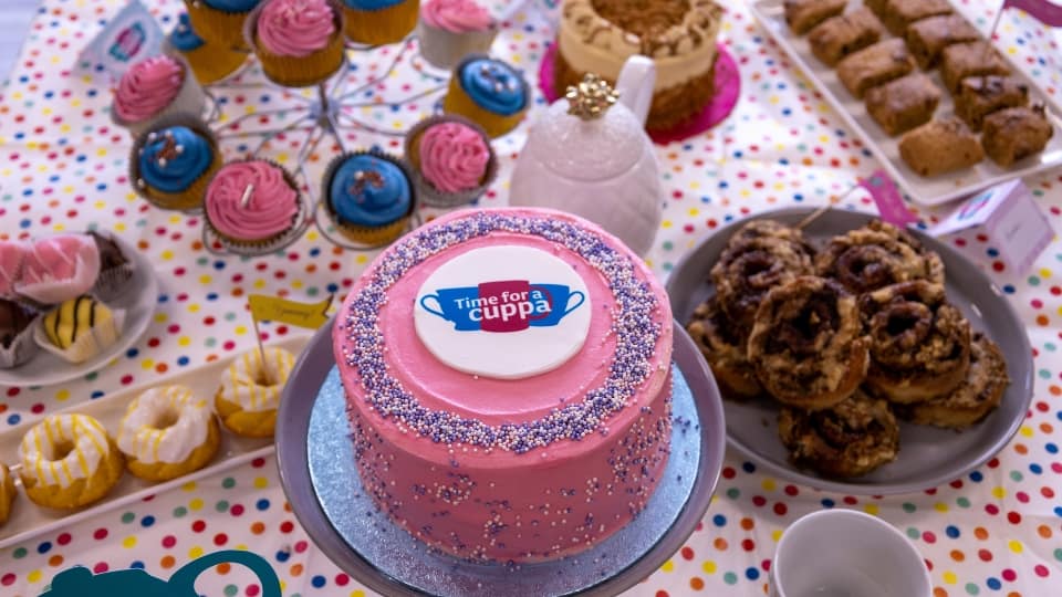 a table with an array of cakes