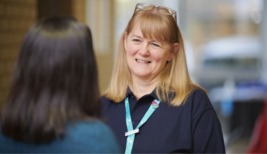 Admiral Nurse Vicky talking with a colleague