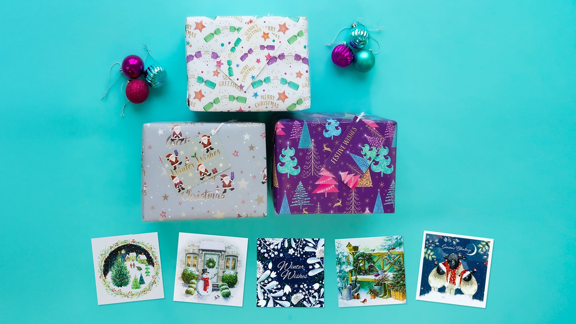 A range of our Christmas cards for sale on a blue background
