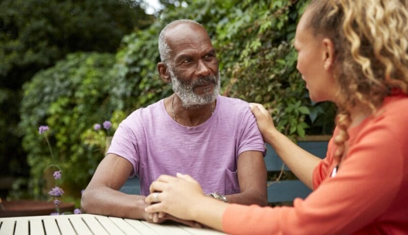 daughter comforts her elderly father with alzheimer's disease