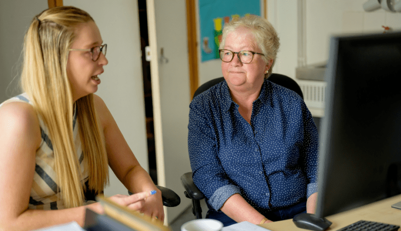 Two women working together in office