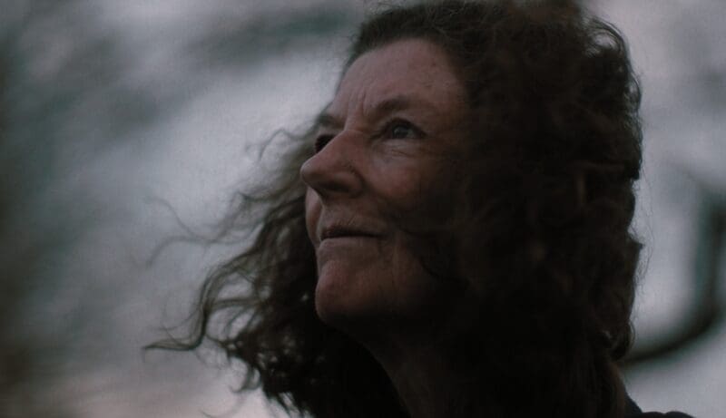 Supporter Karen's face from a profile view