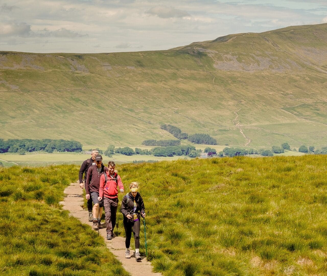 four people hiking the yorkshire three peaks