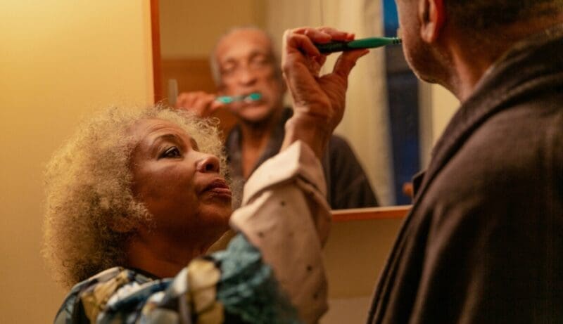 elderly wife cares for her elderly husband with alzheimer's disease