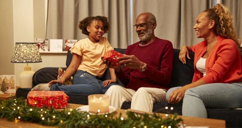 A family at home at Christmas.