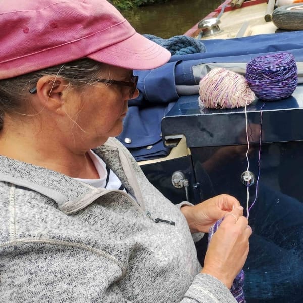 one of dementia uk's fundraisers, pip, knitting