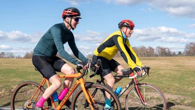 two men cycing in the countryside