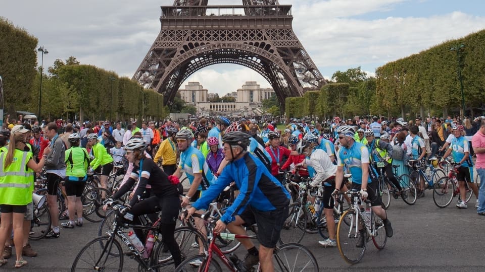 Participants in the London to Paris cycle at the Eiffel tower