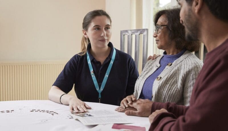 Mother and son talking with an Admiral Nurse