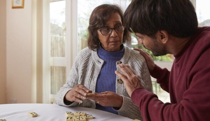 son plays dominoes with elderly mother who has lewy body dementia