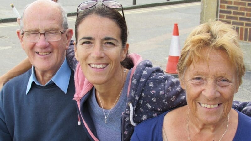 Storyteller Jules with hugging her mum and dad