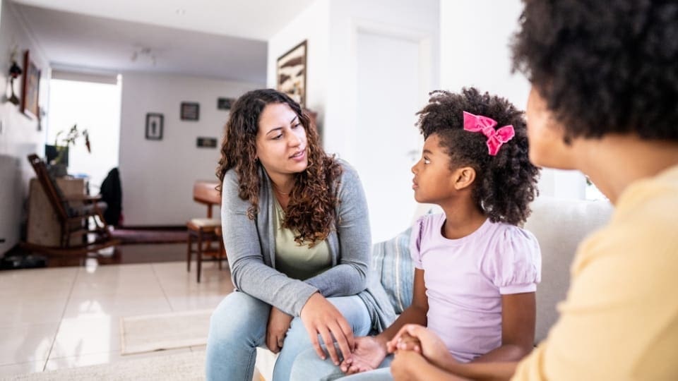 parents explaining something to a child