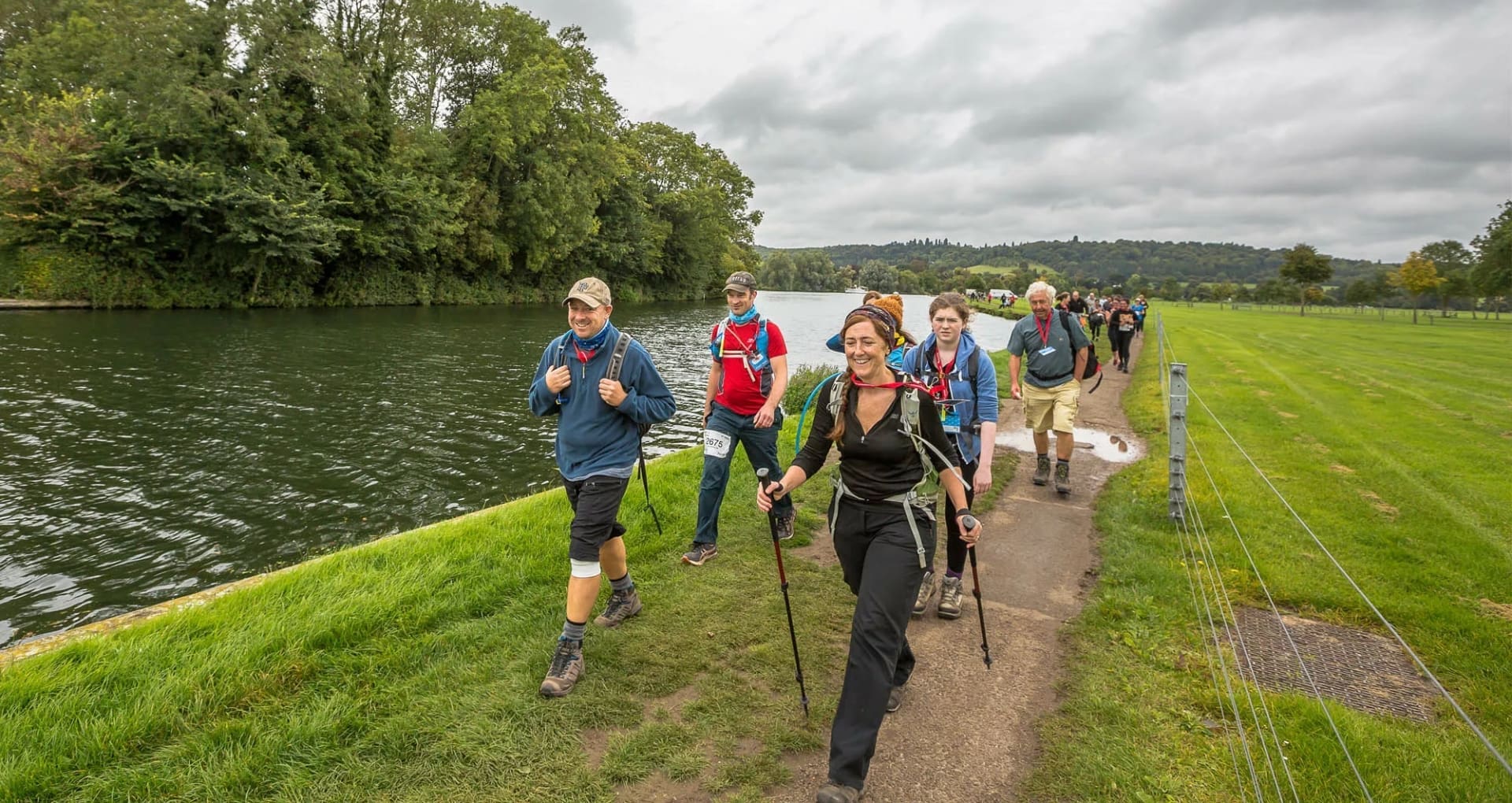 thames path challenge participants walking and jogging alongside the thames