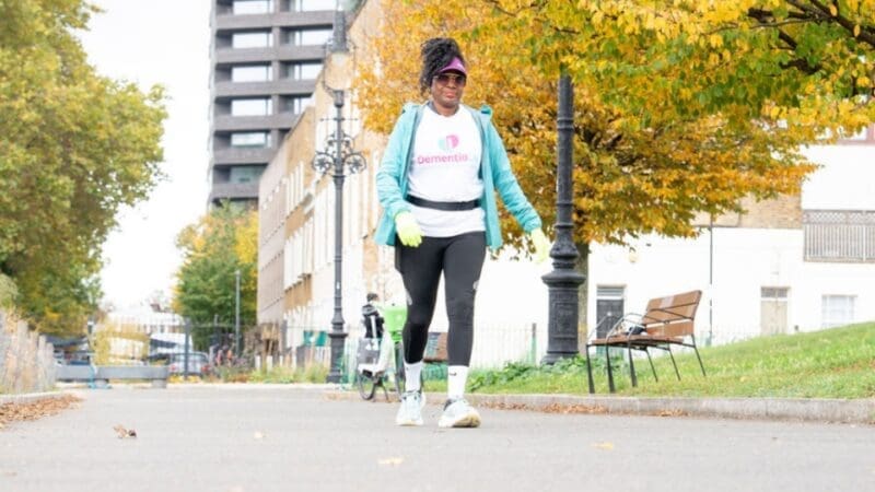 Dementia UK supporter wearing a branded Dementia UK t-shirt and walking