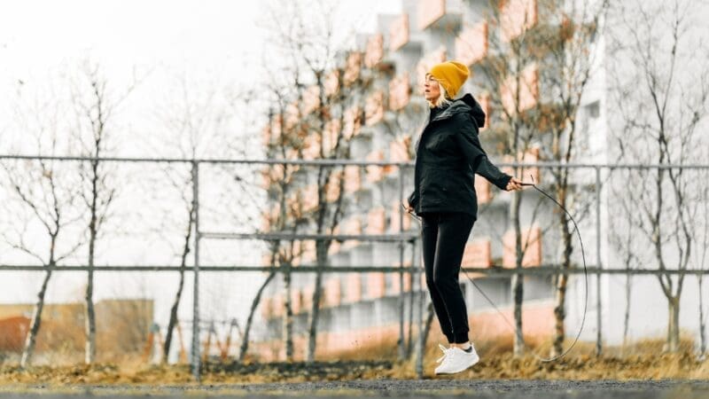 woman skipping outside